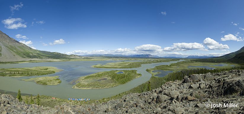 This hand-held stitched panorama of the upper Alsek watershed shows how the river begins as a slow meandering river before it later becomes a raging torrent through unraftable Turnback Canyon.