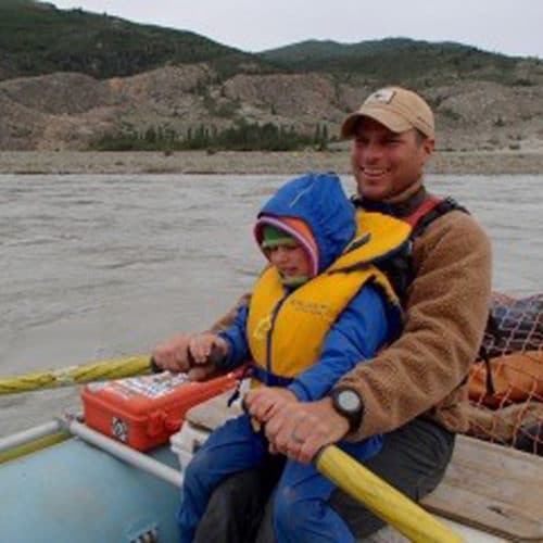 a man and child in a boat