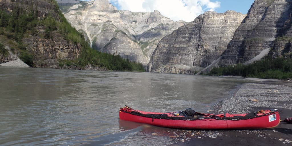 a red canoe on a river