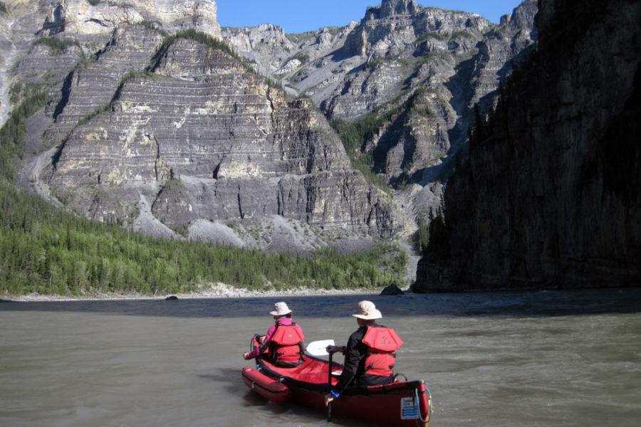 Canoeing through Canada's deepest river canyons on the Nahanni River in Nahanni National Park Preserve.