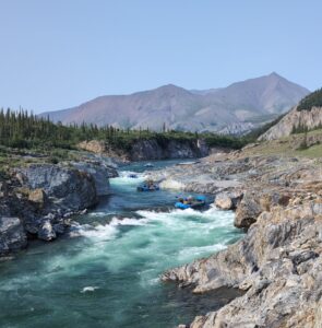 a river with rafts in it