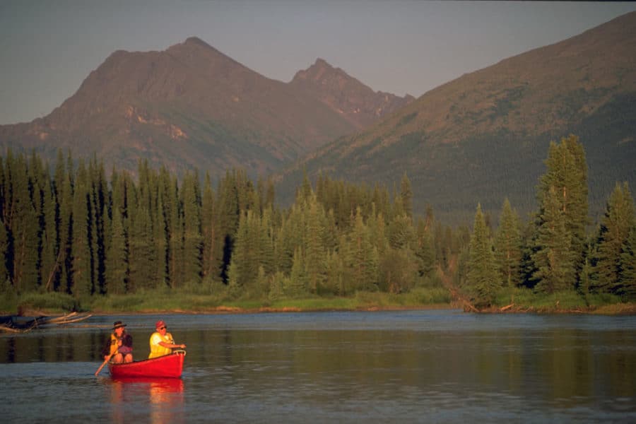 a group of people in a boat on a lake
