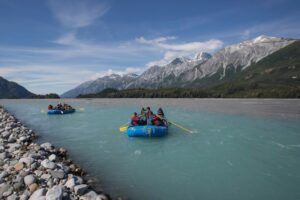 a group of people in rafts on a river