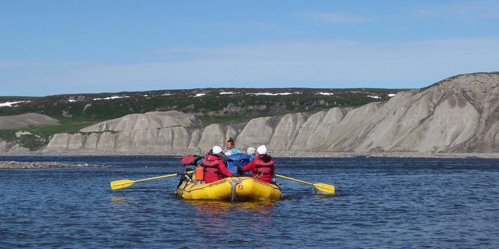 a group of people in a raft