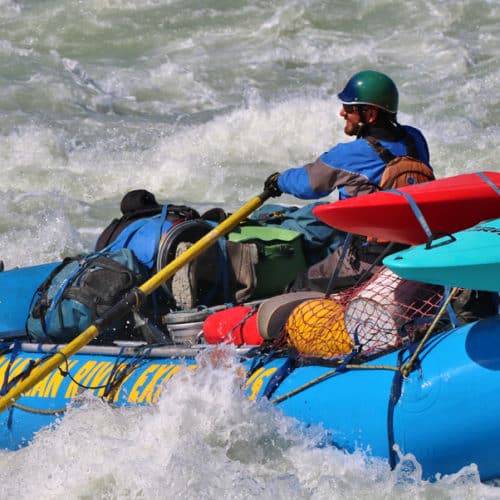 a man in a raft in the water
