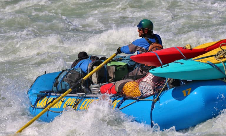 a man in a raft in the water