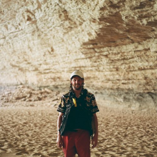 a man standing in a cave