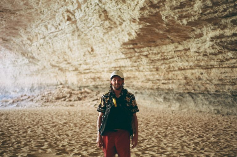 a man standing in a cave