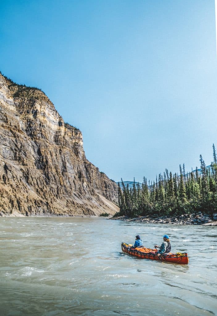Kayakers navigating a scenic river
