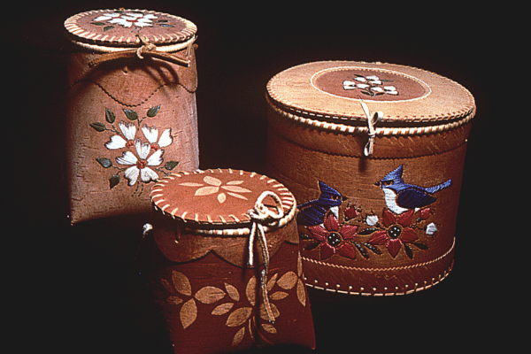 a group of round boxes with designs
