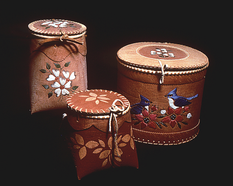a group of round boxes with designs