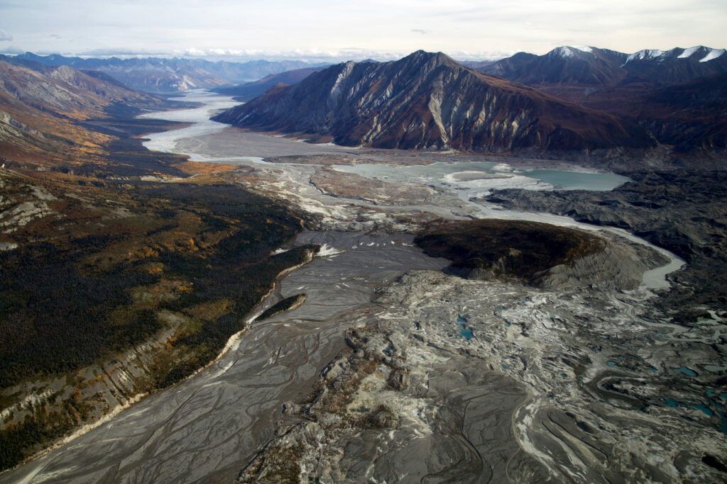 The dry Slims River bed on the left and the now always high Alsek headwaters.