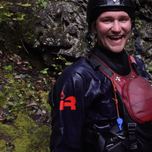 a man wearing a helmet and wet suit