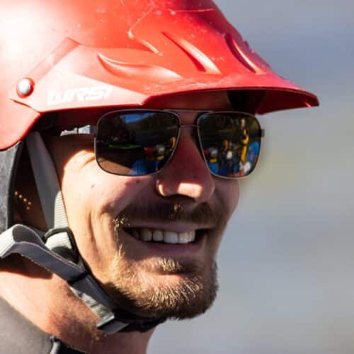 a man wearing a helmet and sunglasses