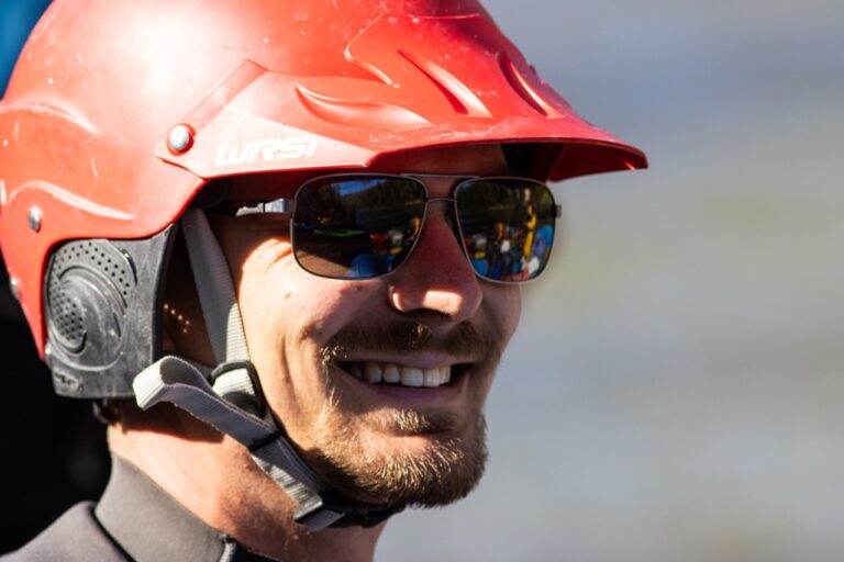 a man wearing a helmet and sunglasses