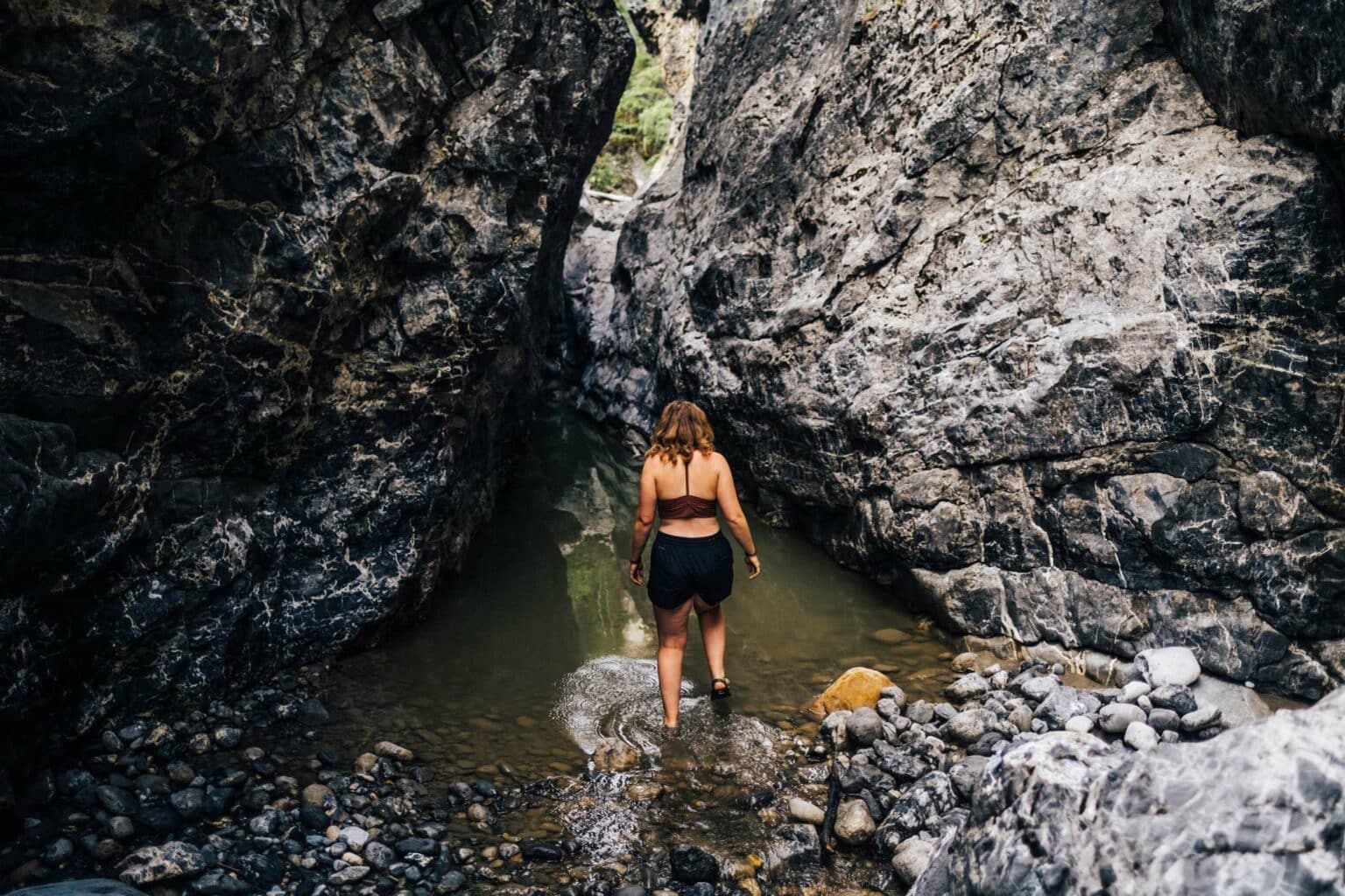 a woman standing in a stream of water