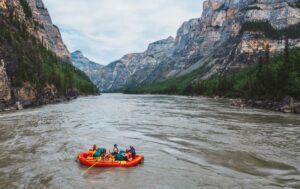 a group of people in a raft on a river