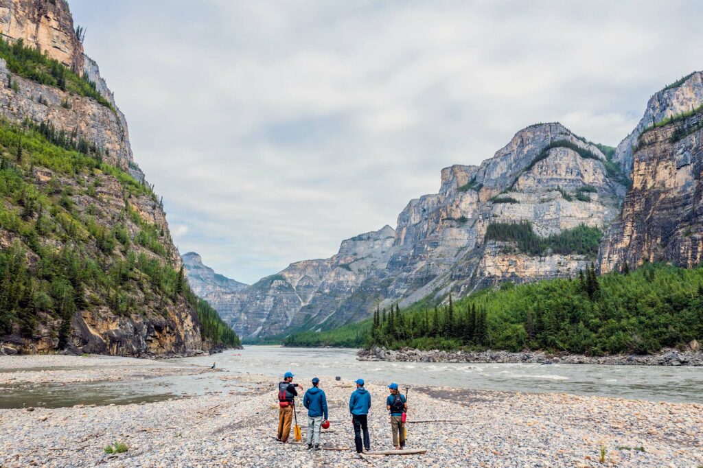 Standing on the shores of the Nahanni River.
