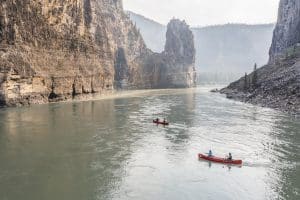 Two canoes on a serene river