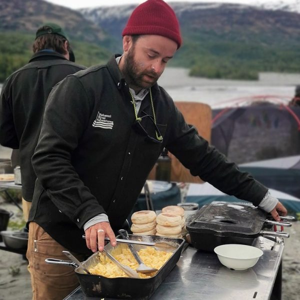 a man cooking food on a table
