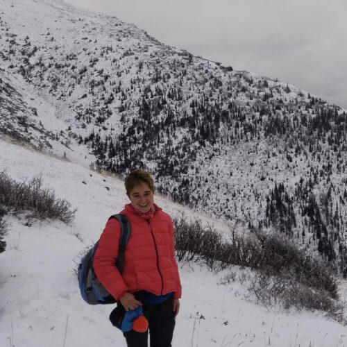 a woman standing in the snow