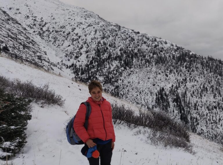 a woman standing in the snow