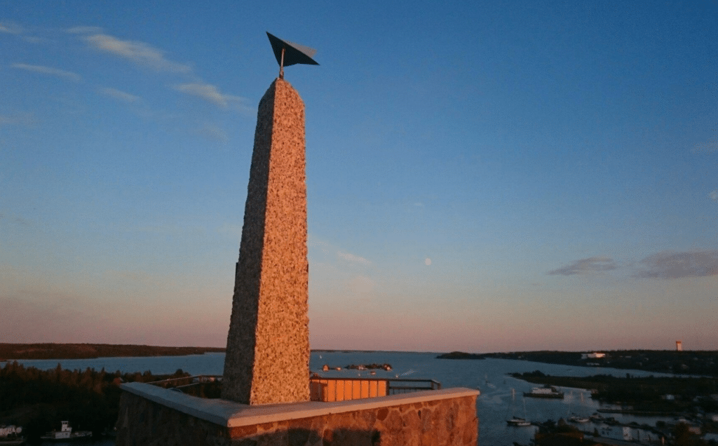 a tower with a flag on top