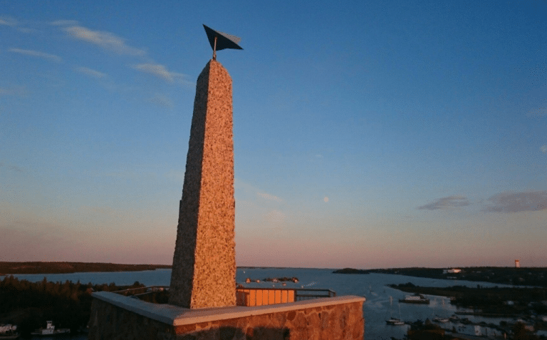 a tower with a flag on top