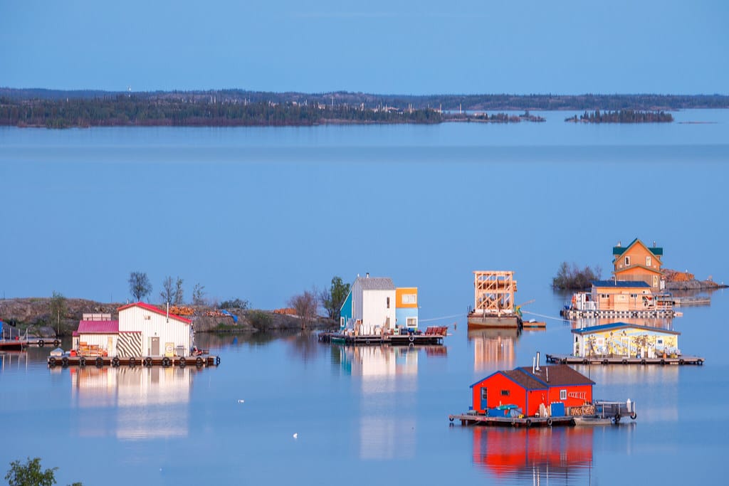 a group of houses on water
