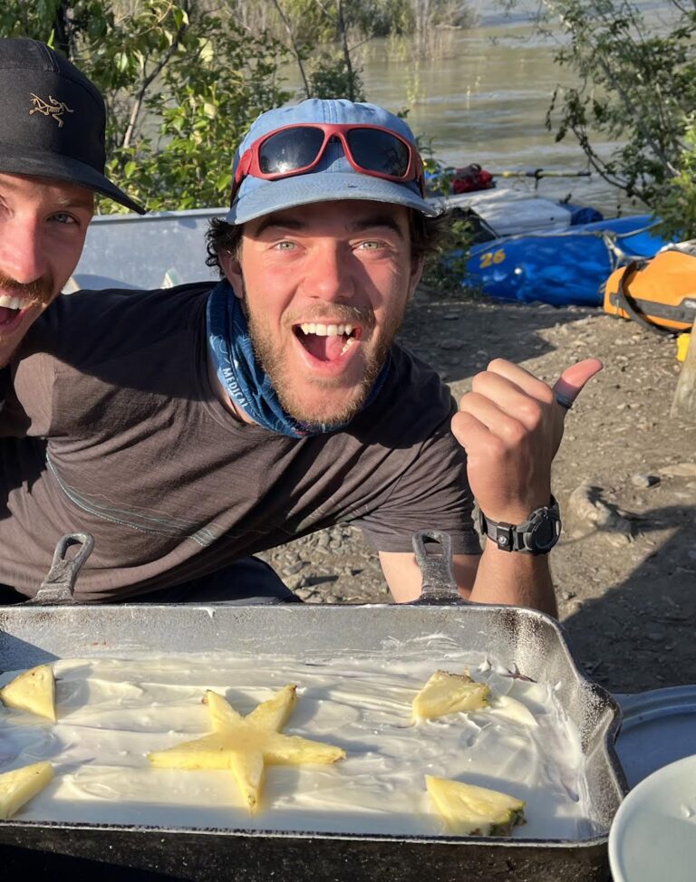 two men smiling at camera