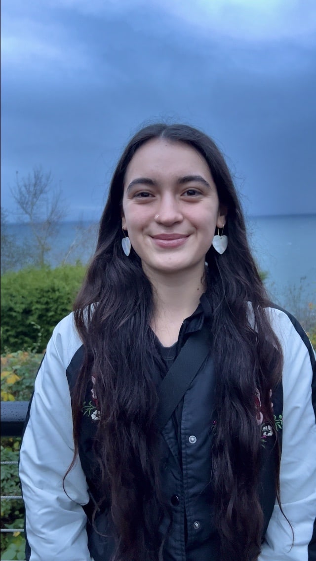 a woman smiling at the camera