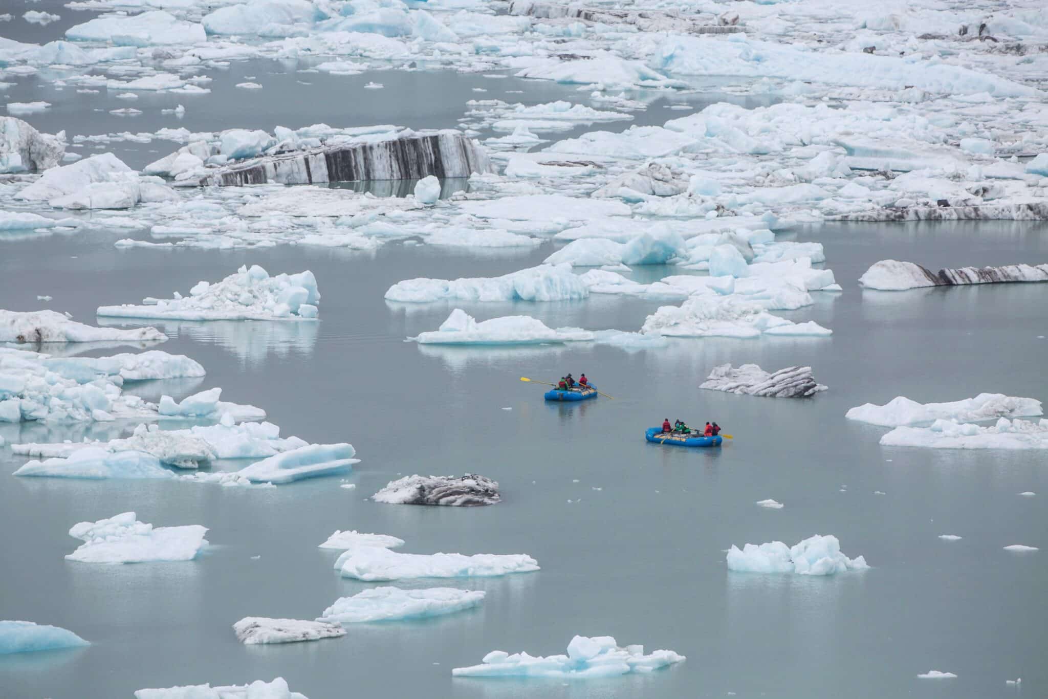 Rafters float among ice bergs at Alsek Lake, Glacier Bay National Park, Alaska.