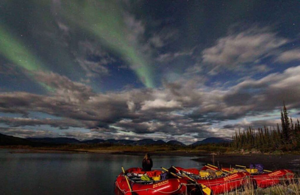 aurora over rafts on the nahanni river, northwest territories, canada