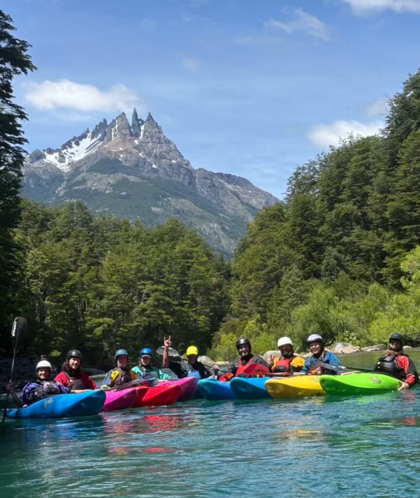 a group of people in kayaks on a river