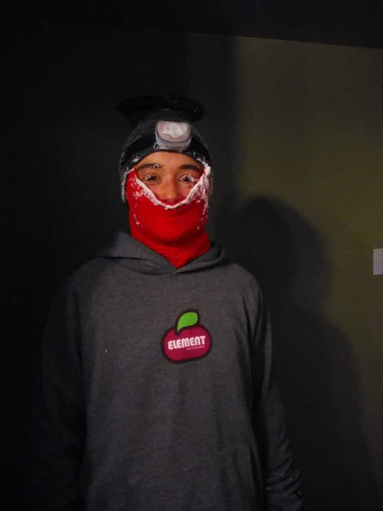 a person wearing a mask and a scarf