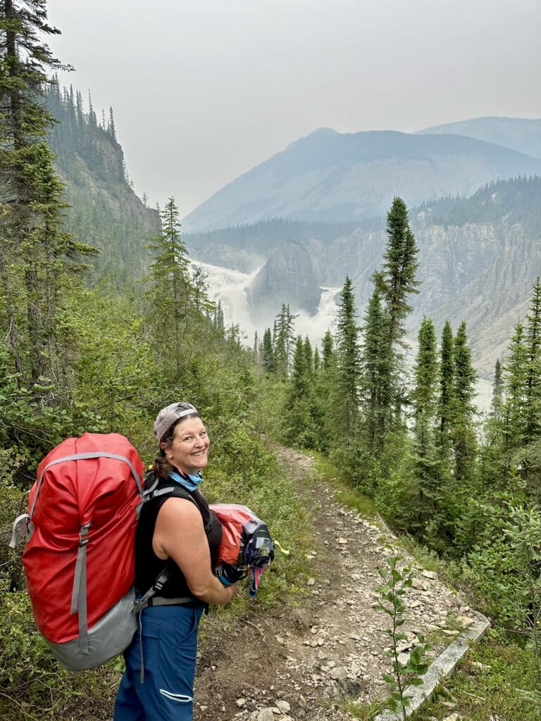 a woman hiking in the mountains